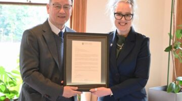 Alpha Group visit, Prof Yihau Gao is presented with a letter of acknowledgement by Provost Prof Giselle Byrnes (1)