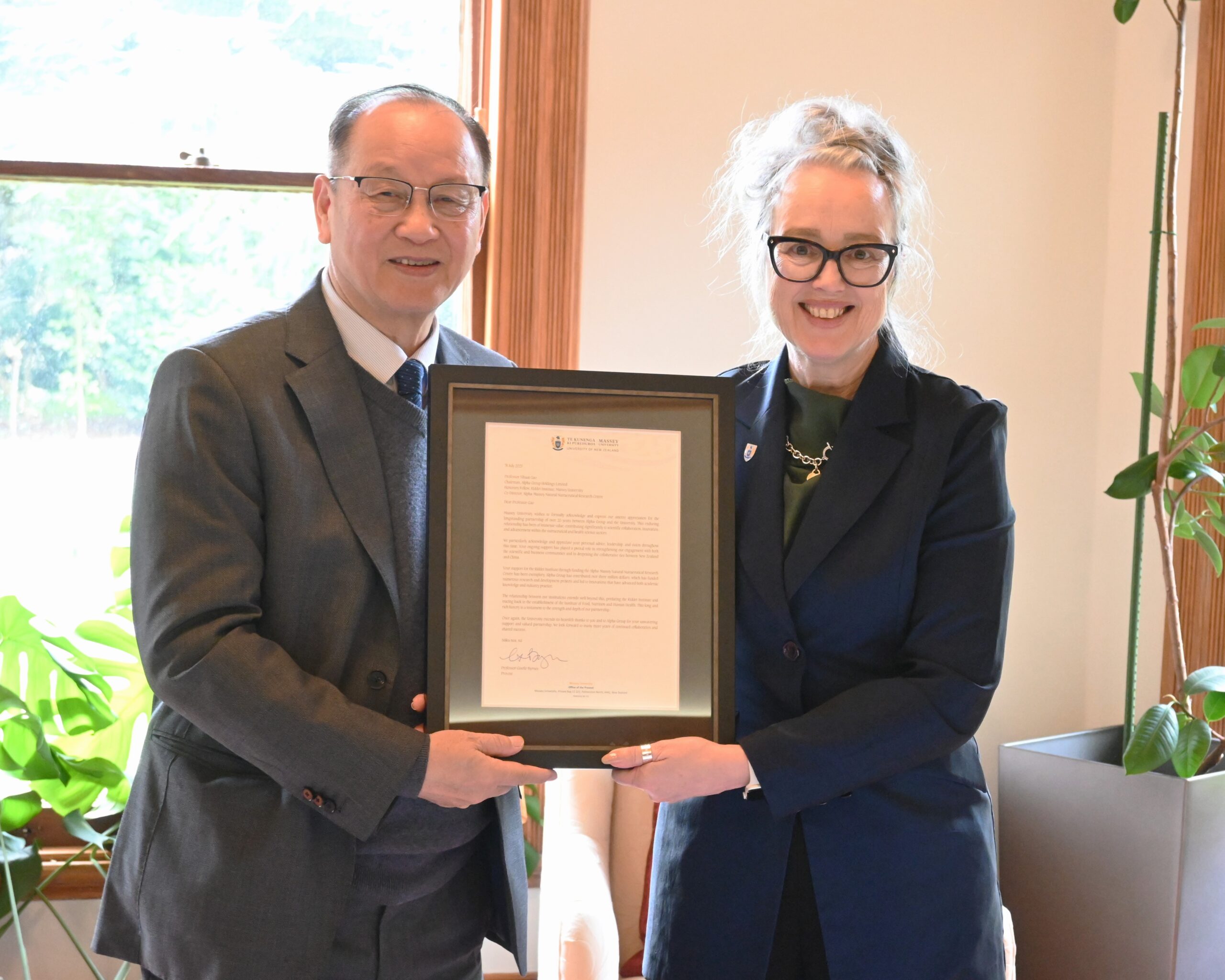 Alpha Group visit, Prof Yihau Gao is presented with a letter of acknowledgement by Provost Prof Giselle Byrnes (1)